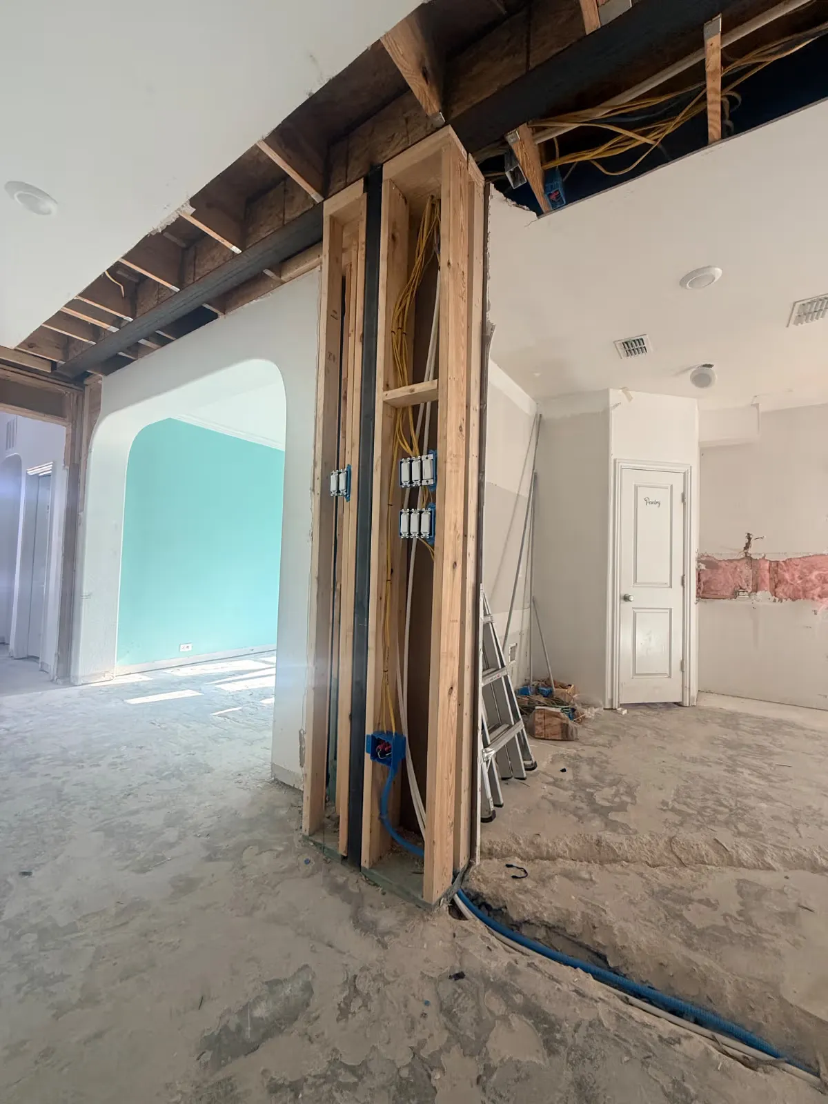 Interior opened to the studs and ceiling joists during a renovation